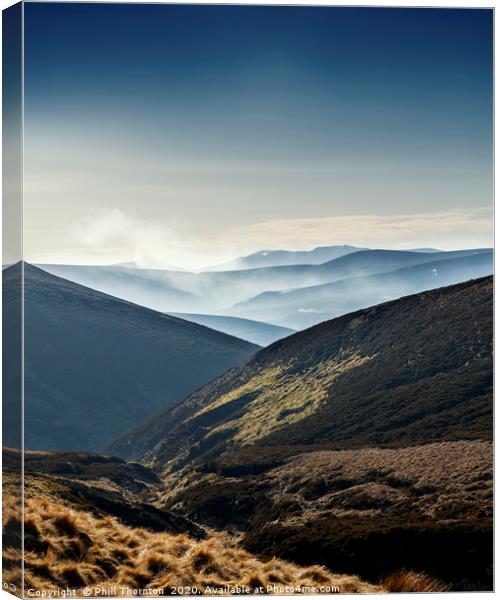 Misty mountains and valleys from the Snow Road Canvas Print by Phill Thornton