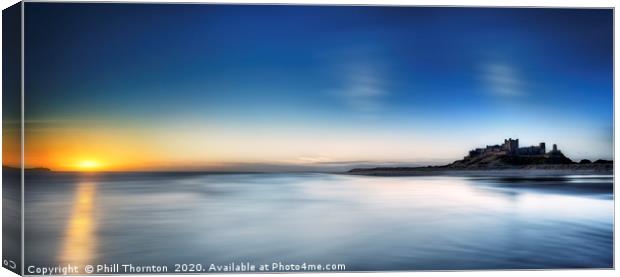 Sunrise over Bamburgh Castle No. 3 Canvas Print by Phill Thornton