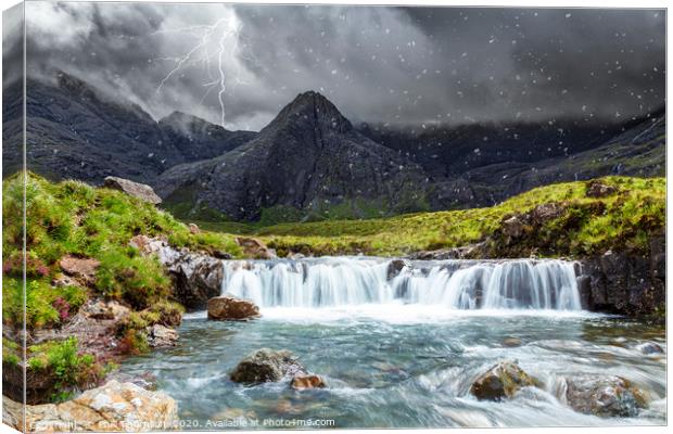 Spring lightning storm at the Fairy Pools. Canvas Print by Phill Thornton