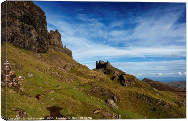 Blue skies over the Quiraing cliffs, Skye. Canvas Print by Phill Thornton