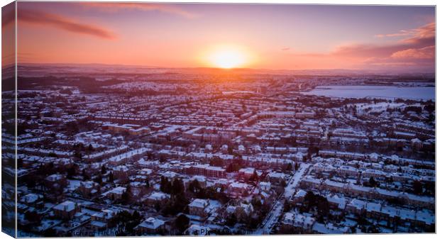 Sunrise over a snowy suburb Canvas Print by Richard Nicholls