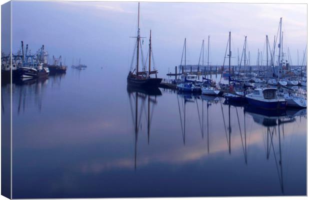 Eerie early morning Brixham harbour Canvas Print by Steve Mantell