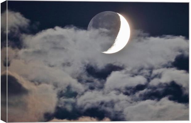 Cloudy Crescent Moon with Earthshine Canvas Print by Susan Snow