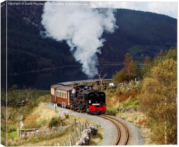 Welsh Highland Railway locomotive No87 winds its way to Rhyd Ddu. Canvas Print by David Thurlow