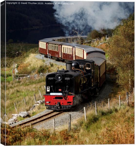 Welsh Highland Railway locomotive No87 winds its way to Rhyd Ddu. Canvas Print by David Thurlow