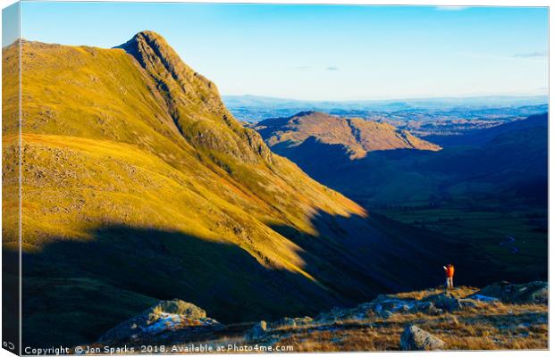 Walker looking towards Pike o’Stickle Canvas Print by Jon Sparks