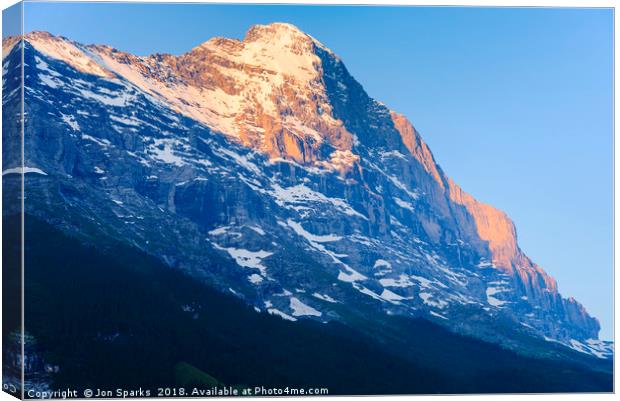 Morning light on the Eiger Canvas Print by Jon Sparks