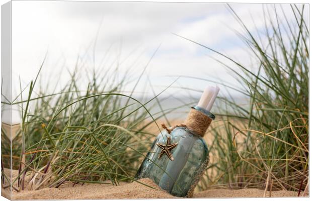 Message in a bottle in the dunes Canvas Print by Anthony Hart