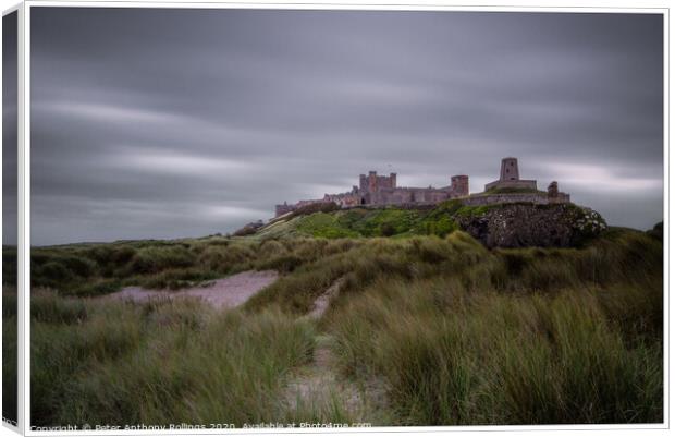 Bamburgh Castle Canvas Print by Peter Anthony Rollings