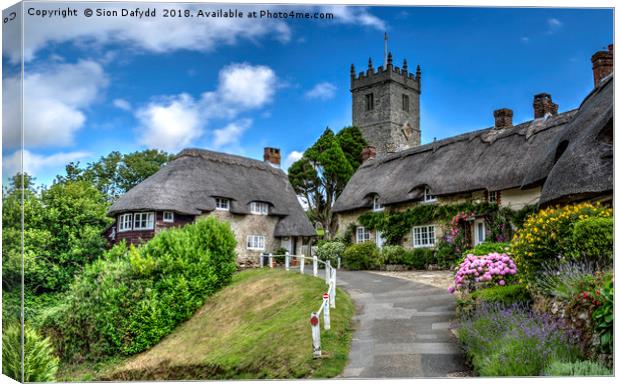 Thatched Cottages at Godshill Canvas Print by Sion Dafydd