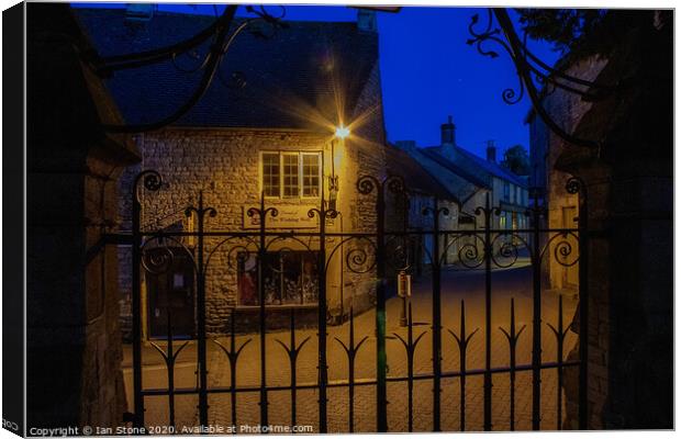 Lamplight in Stow on the Wold  Canvas Print by Ian Stone