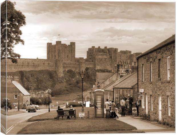 Bamburgh Village and Castle - Sepia Canvas Print by Philip Brown