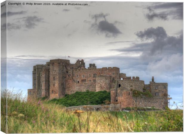 Bamburgh Castle in Northumberland Canvas Print by Philip Brown