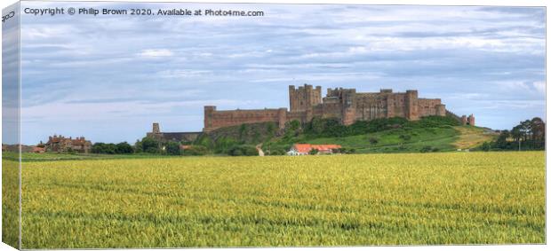 Bamburgh Castle in Northumberland, Panorama Canvas Print by Philip Brown