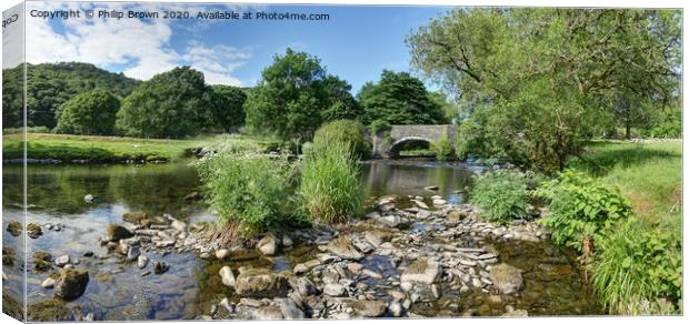 Welsh stream leading to an old bridge Canvas Print by Philip Brown