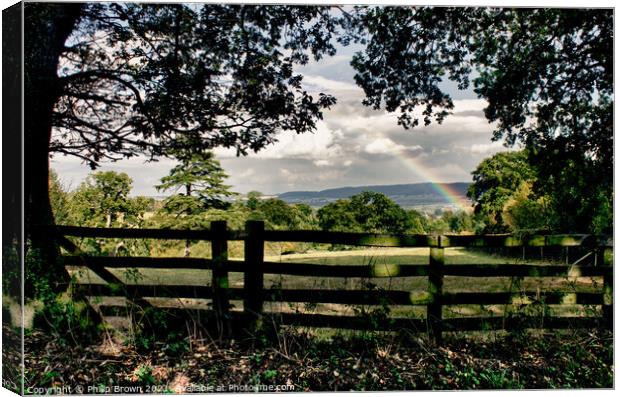 Rainbow over the fence & through the trees Canvas Print by Philip Brown