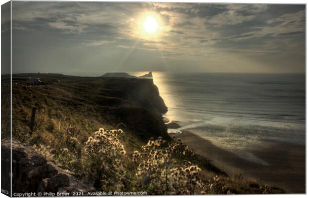 Sun setting across Worms Head, Rhosilli, The Gower Canvas Print by Philip Brown