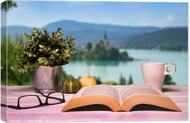 A book opened on the table Canvas Print by Sergio Delle Vedove