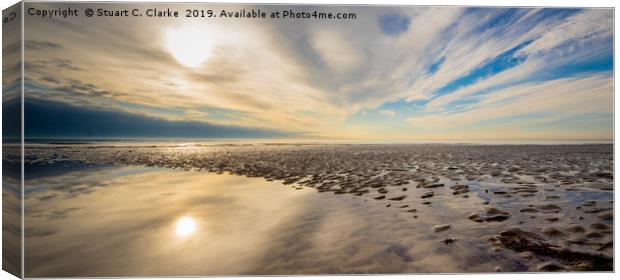 Low tide reflections Canvas Print by Stuart C Clarke