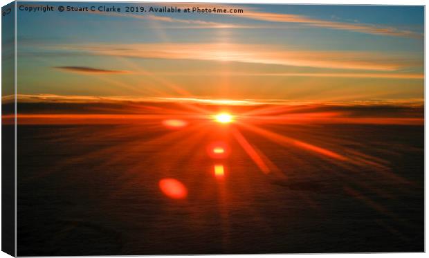 Sunset above the clouds Canvas Print by Stuart C Clarke