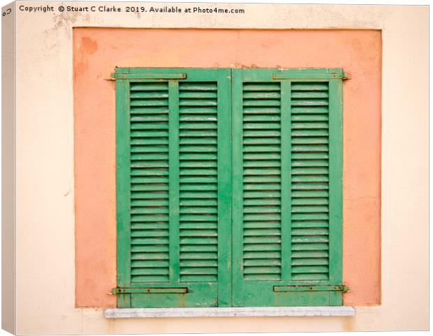Windows shutters Canvas Print by Stuart C Clarke