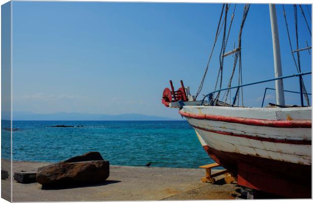Old Fishing Boat in Aegina Harbour Canvas Print by Cassi Moghan