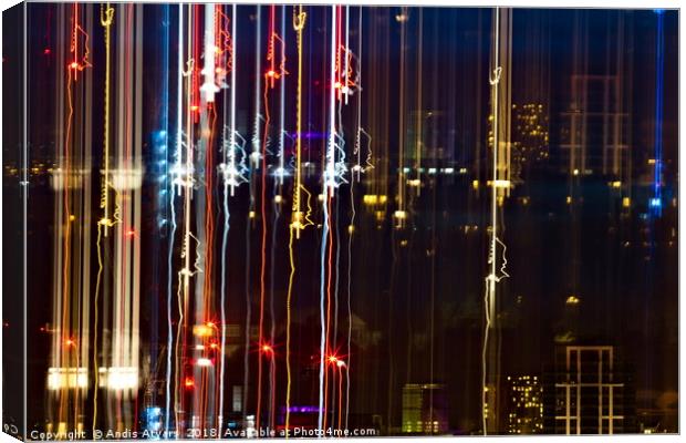 City life of dazzling lights and colors Canvas Print by Andis Atvars