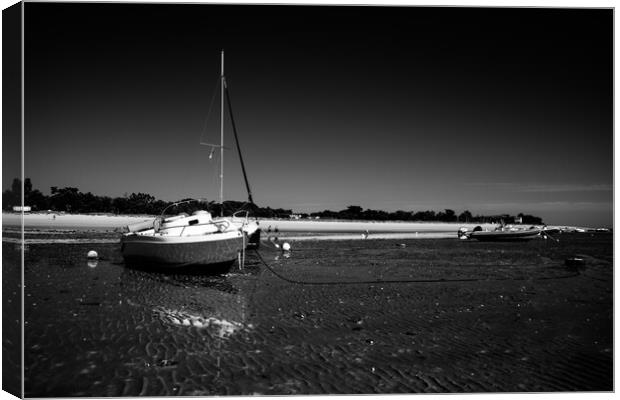 boats laying on the beach in blackwhite Canvas Print by youri Mahieu