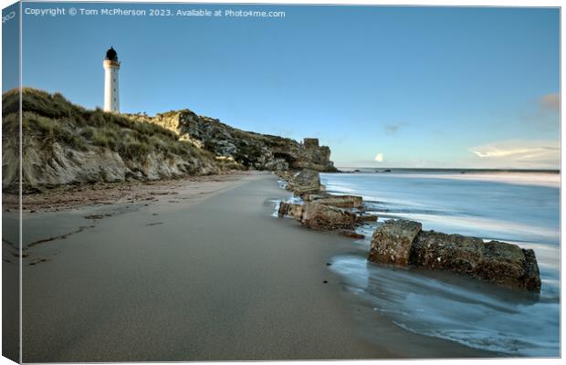 Lossiemouth lighthouse, with Covesea caves and beach below Canvas Print by Tom McPherson