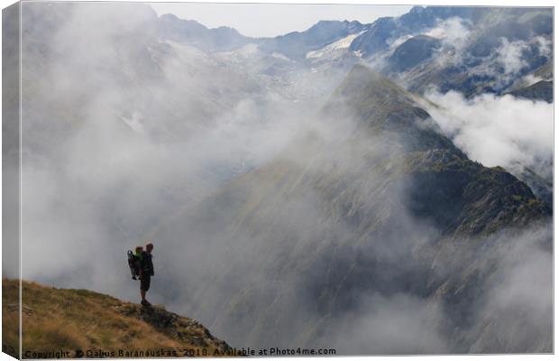 Hiker in France alps standing on edge of mountain  Canvas Print by Dalius Baranauskas