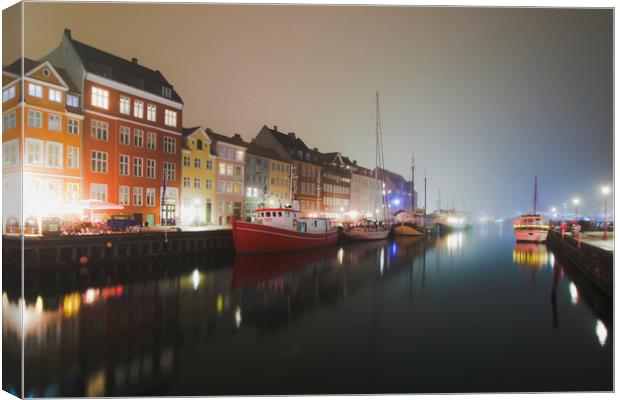 Foggy evening in Nyhavn canal Canvas Print by Dalius Baranauskas