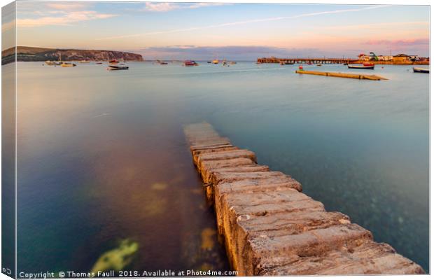 Stone jetty in Swanage Harbour Canvas Print by Thomas Faull