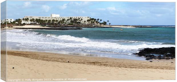 Lanzarote beach with hotel in the back ground  Canvas Print by Holly Burgess