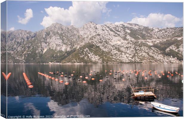 Kotor Mountain range over the Loch Canvas Print by Holly Burgess