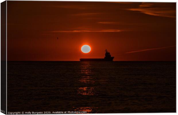 Dawn's Embrace on Caister Beach Canvas Print by Holly Burgess