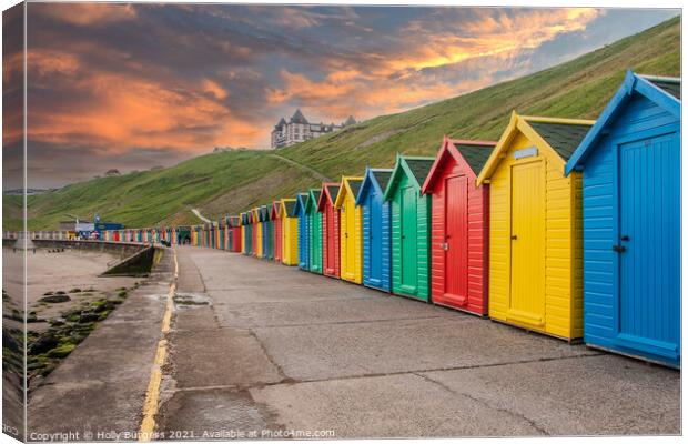 Whitby's Colourful Beach Huts at Sunset Canvas Print by Holly Burgess