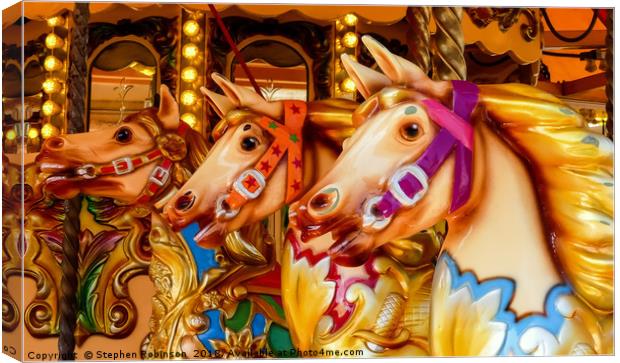 Three colourful hand painted carousel horses Canvas Print by Stephen Robinson
