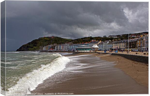Aberystwyth on a stormy day with Constitution hill in the distance Canvas Print by Jenny Hibbert