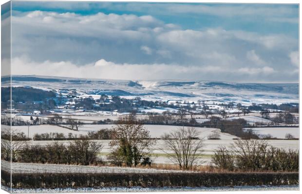 Winter sun on Barningham, Teesdale in the snow Canvas Print by Richard Laidler