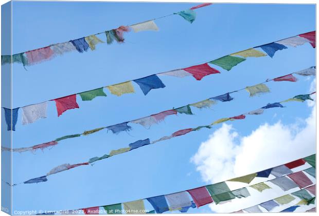 Tibetan prayer flags against the blue sky Canvas Print by Lensw0rld 