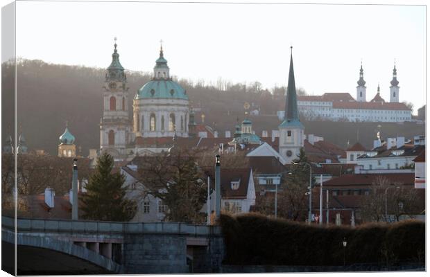 Church towers and historic buildings in the evening sun in Prague Canvas Print by Lensw0rld 
