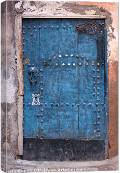 Ancient blue door in the old town of Marrakesh Canvas Print by Lensw0rld 