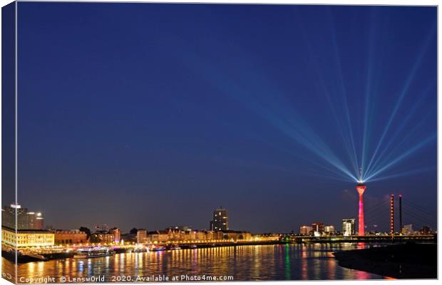 Light show from Düsseldorf's "Rheinturm" at night Canvas Print by Lensw0rld 