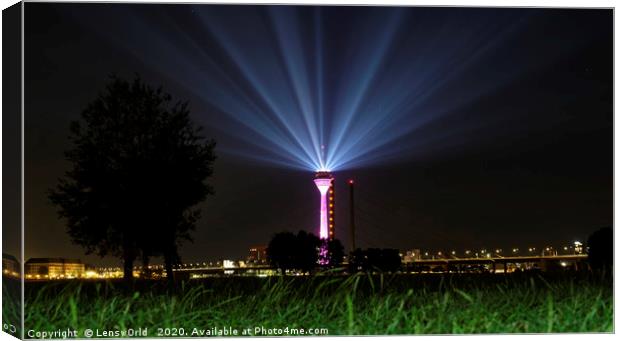 Light show from Düsseldorf's "Rheinturm" at night Canvas Print by Lensw0rld 