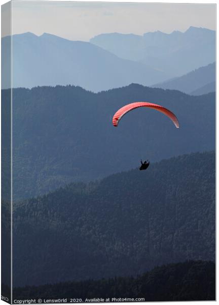 Paraglider in front of a mountain panorama Canvas Print by Lensw0rld 