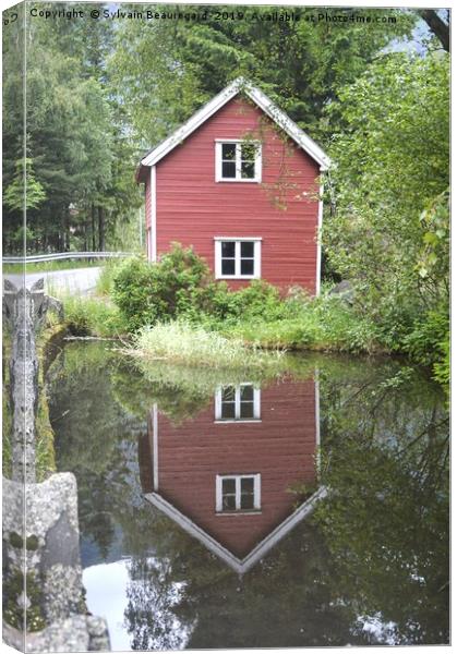 Reflection of a little red house Canvas Print by Sylvain Beauregard