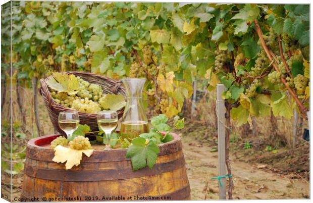 white wine and grape on barrel in vineyard Canvas Print by goce risteski