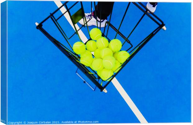 Basket full of yellow tennis balls for training tennis players o Canvas Print by Joaquin Corbalan