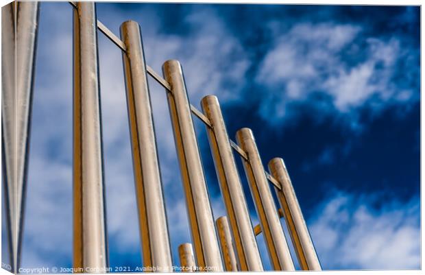 Metal bars protect an institutional building. Canvas Print by Joaquin Corbalan