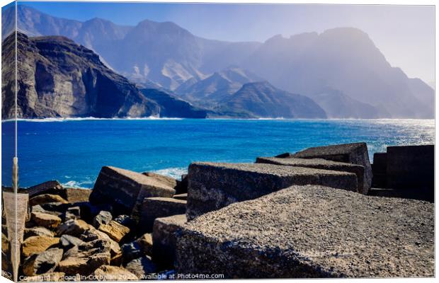 Entrance to the mouth of the port of Agaete with the beautiful c Canvas Print by Joaquin Corbalan